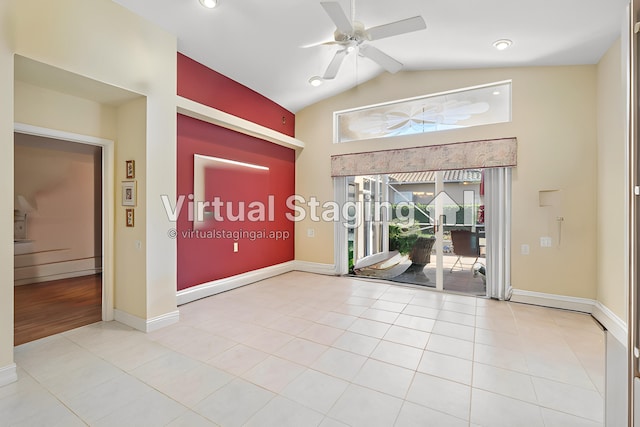 empty room featuring light tile patterned floors, baseboards, ceiling fan, and vaulted ceiling