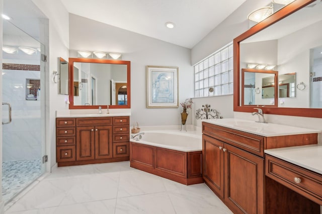 bathroom with vaulted ceiling, a bath, a stall shower, and a sink