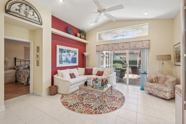 living area featuring light tile patterned floors, baseboards, high vaulted ceiling, and a ceiling fan