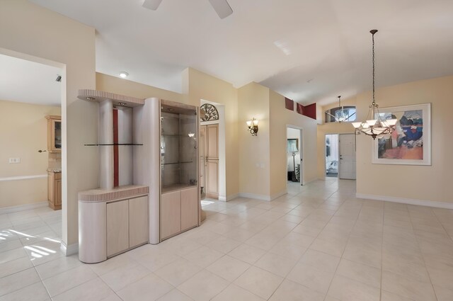 6630 Maybrook Rd, Boynton Beach, FL 33437 - unfurnished room featuring a high ceiling, a ceiling fan, light tile patterned floors, baseboards, and a chandelier