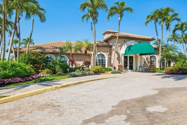 6630 Maybrook Rd, Boynton Beach, FL 33437 - view of exterior entry with stucco siding