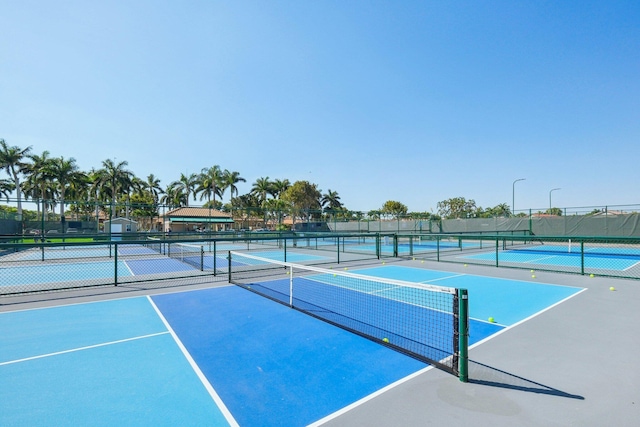 view of tennis court featuring fence