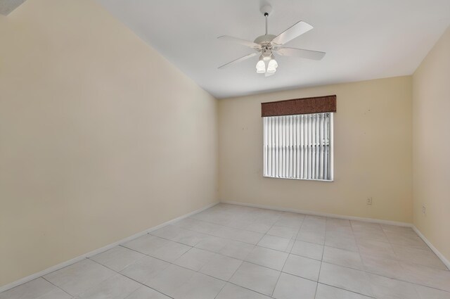 6630 Maybrook Rd, Boynton Beach, FL 33437 - spare room with light wood-type flooring, vaulted ceiling, baseboards, and ceiling fan