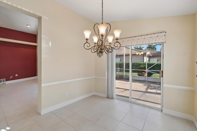 6630 Maybrook Rd, Boynton Beach, FL 33437 - unfurnished dining area with a chandelier, light tile patterned floors, and baseboards