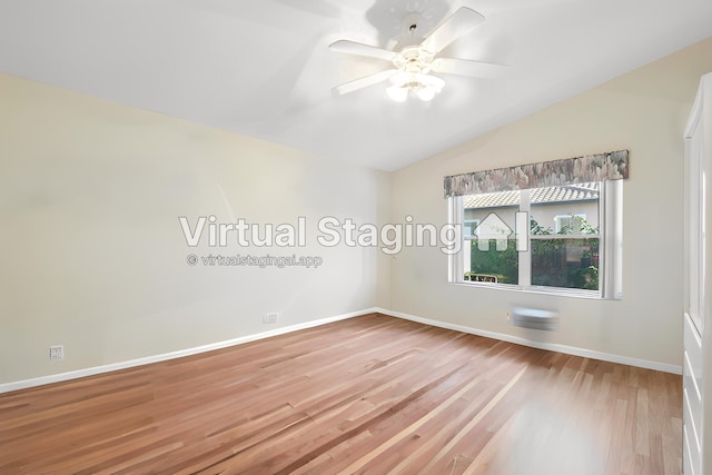 unfurnished room featuring baseboards, lofted ceiling, a ceiling fan, and light wood finished floors