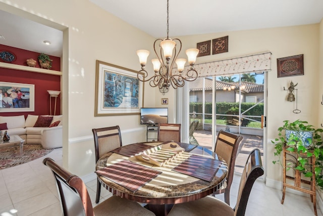 dining room featuring baseboards, an inviting chandelier, and light tile patterned flooring