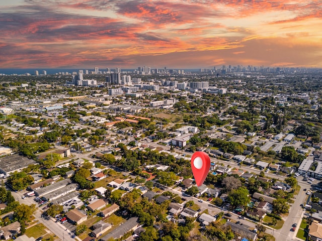 aerial view at dusk featuring a view of city