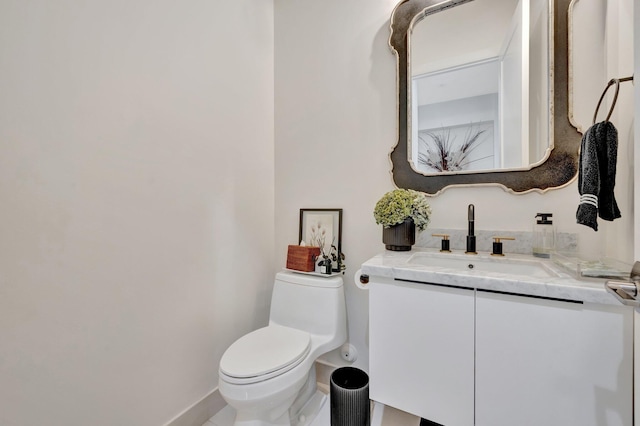 half bathroom with toilet and vanity