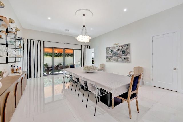 dining area featuring light tile patterned floors, recessed lighting, and a chandelier