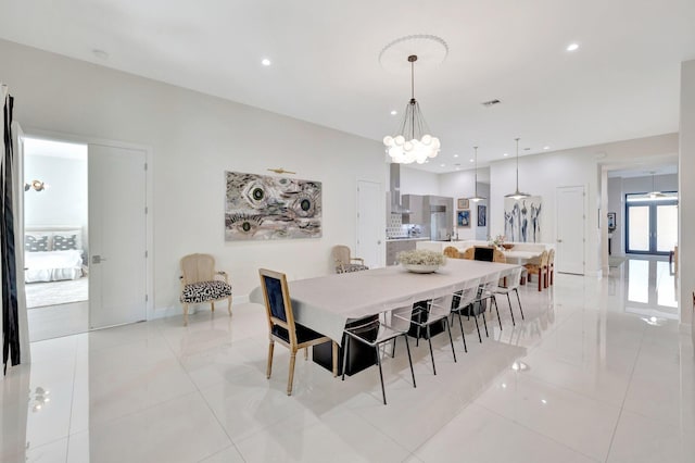 dining room featuring visible vents, baseboards, recessed lighting, light tile patterned flooring, and a notable chandelier