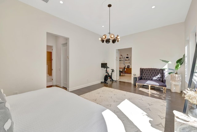 bedroom with recessed lighting, an inviting chandelier, and wood finished floors