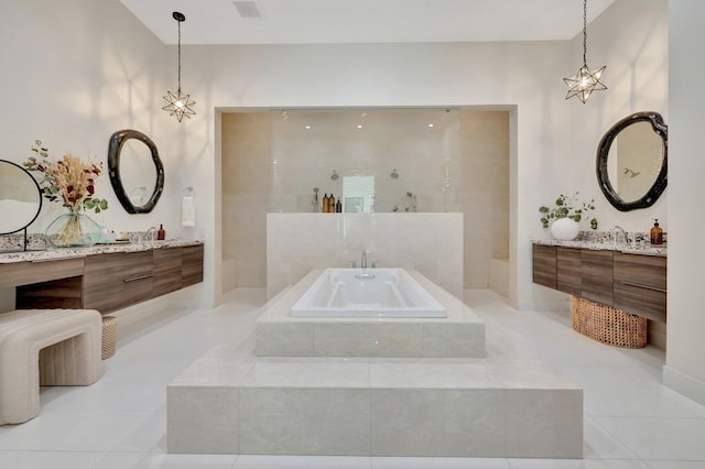 full bath featuring visible vents, a garden tub, two vanities, a walk in shower, and tile patterned flooring