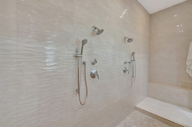 bathroom with tiled shower