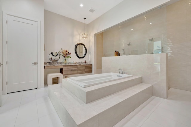 full bathroom with tile patterned floors, a garden tub, and a walk in shower