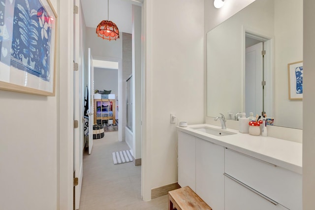 bathroom with vanity and baseboards