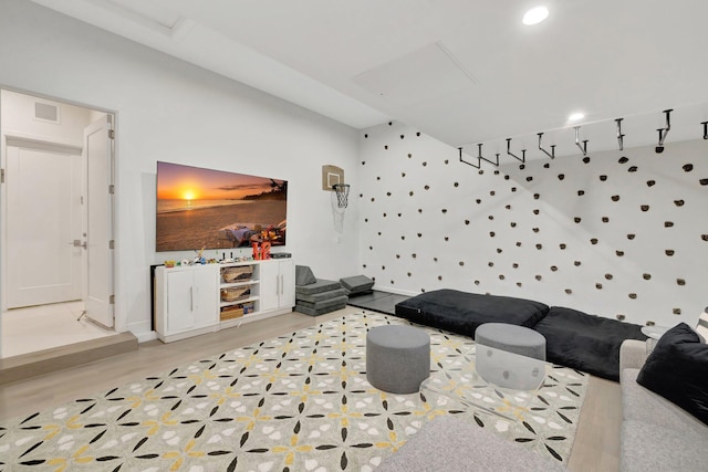 playroom with visible vents, baseboards, and light wood finished floors