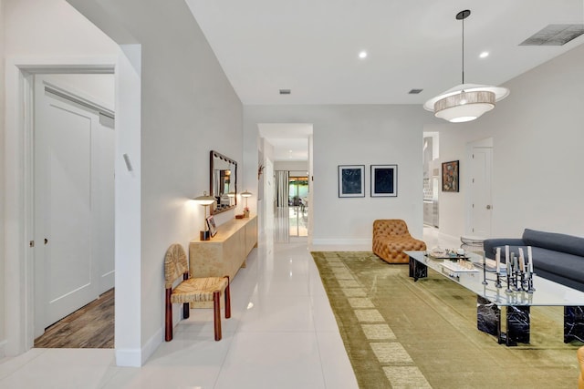 interior space featuring recessed lighting, baseboards, visible vents, and light tile patterned floors