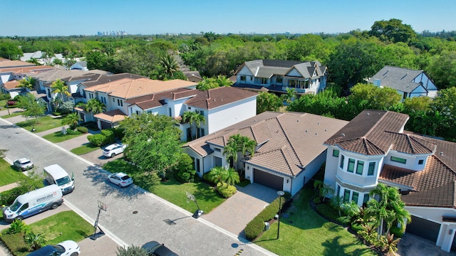 aerial view featuring a residential view and a wooded view