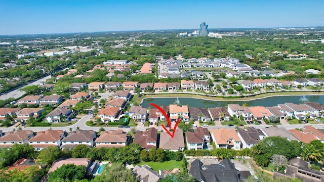 bird's eye view featuring a residential view and a water view