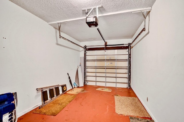 garage with a garage door opener and baseboards