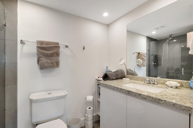 bathroom with vanity, visible vents, recessed lighting, a shower stall, and toilet