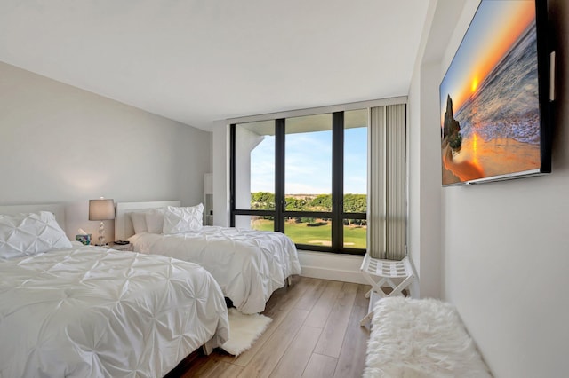 bedroom featuring wood finished floors