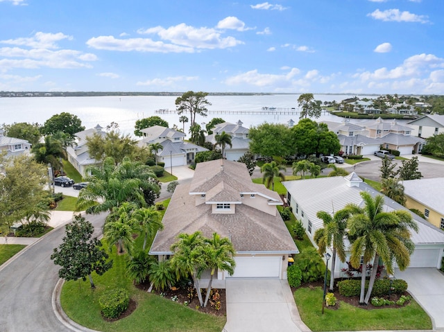 birds eye view of property featuring a residential view and a water view