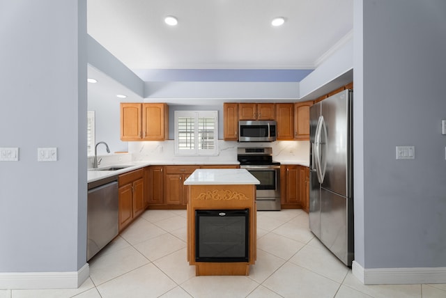 kitchen with light countertops, light tile patterned floors, decorative backsplash, stainless steel appliances, and a sink