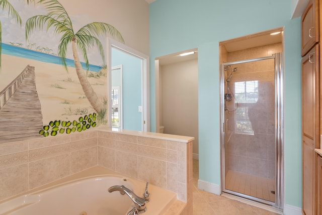 full bath featuring tile patterned floors, a garden tub, toilet, a shower stall, and baseboards