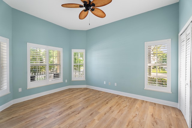 2010 NW Estuary Ct, Stuart, FL 34994 - unfurnished room with ceiling fan, light wood-style floors, and plenty of natural light
