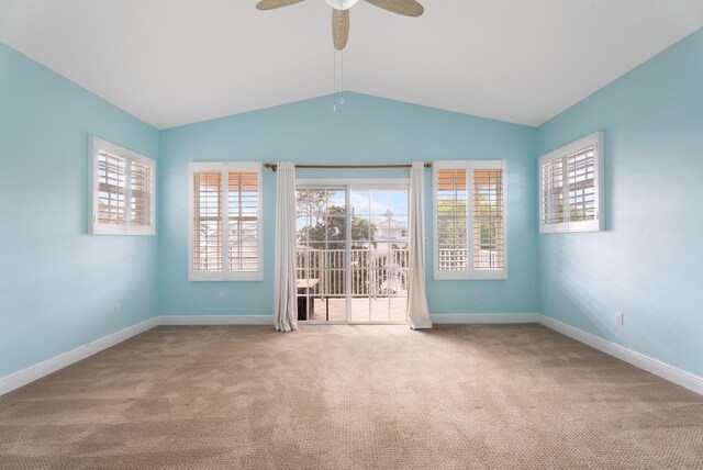 2010 NW Estuary Ct, Stuart, FL 34994 - spare room with carpet floors, healthy amount of natural light, lofted ceiling, and ceiling fan