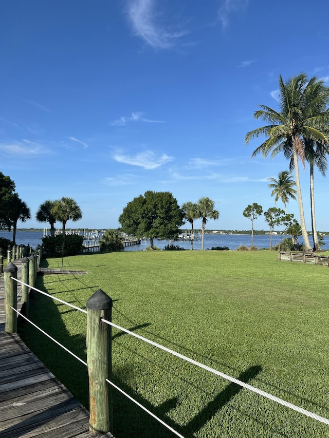 2010 NW Estuary Ct, Stuart, FL 34994 - dock featuring a water view