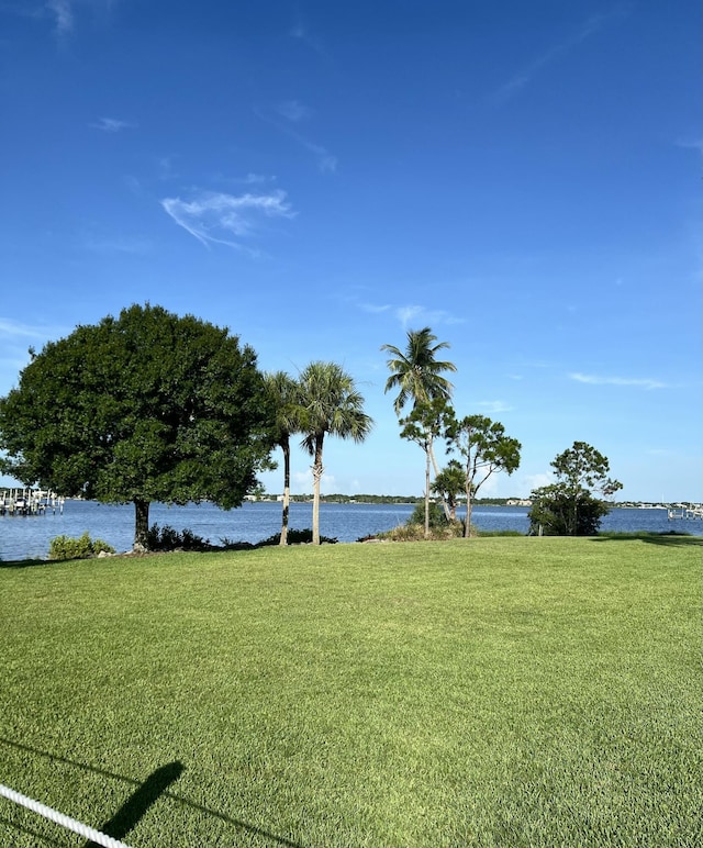2010 NW Estuary Ct, Stuart, FL 34994 - view of grassy yard with a water view