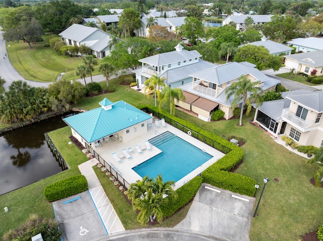 birds eye view of property featuring a residential view and a water view