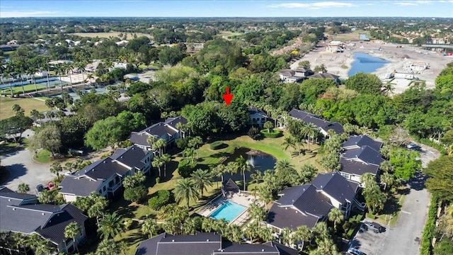 drone / aerial view with a residential view and a water view