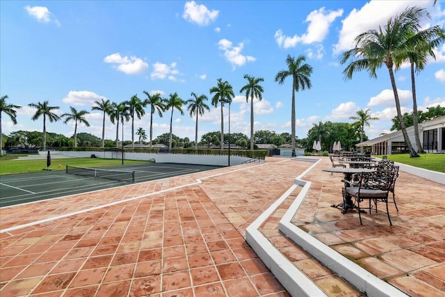 view of community featuring a tennis court