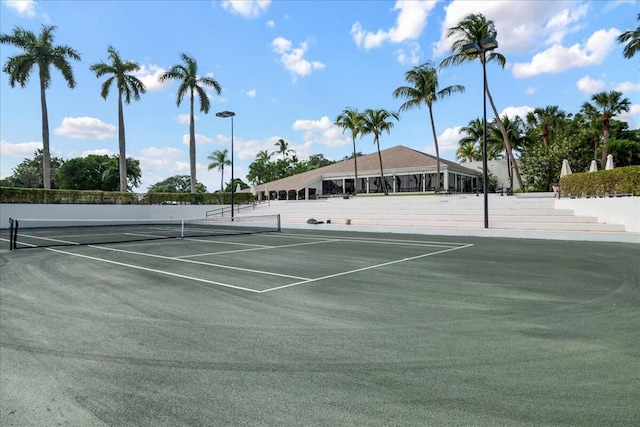 view of tennis court with community basketball court