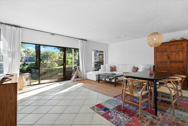 living room with light tile patterned floors and a textured ceiling