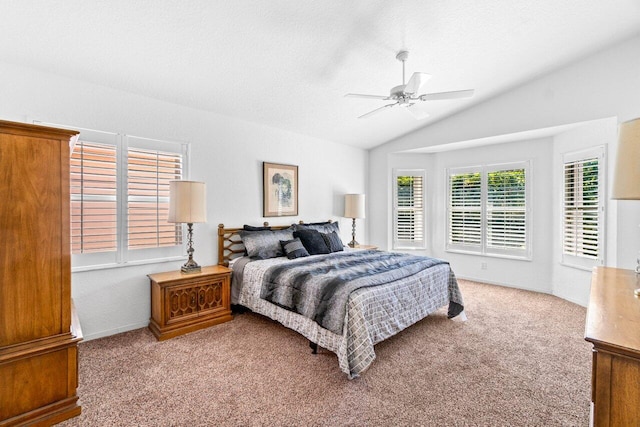 bedroom featuring a ceiling fan, vaulted ceiling, carpet, and a textured ceiling