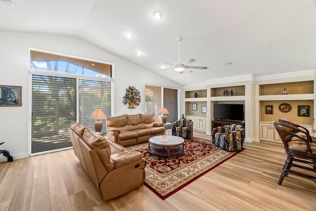 living area with built in features, baseboards, lofted ceiling, ceiling fan, and light wood-style floors