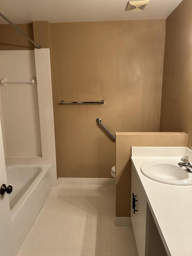 1732 W Sanderling Ln Unit 1, Fort Pierce, FL 34982 - bathroom featuring tile patterned floors, vanity, toilet, tub / shower combination, and baseboards
