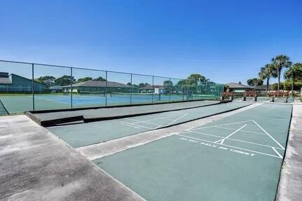 1732 W Sanderling Ln Unit 1, Fort Pierce, FL 34982 - view of community featuring a tennis court and shuffleboard