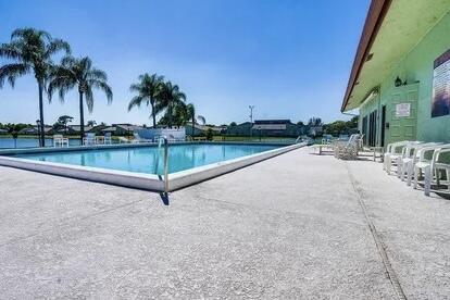1732 W Sanderling Ln Unit 1, Fort Pierce, FL 34982 - community pool featuring a patio area