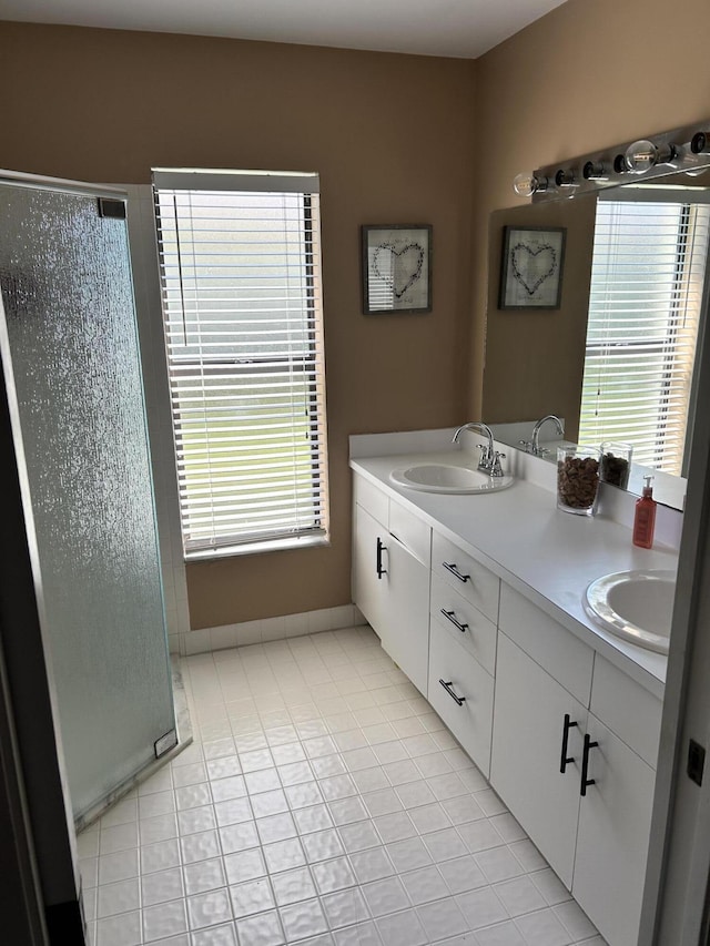 1732 W Sanderling Ln Unit 1, Fort Pierce, FL 34982 - full bath with double vanity, a shower stall, and tile patterned floors