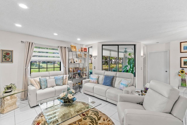 tiled living room with recessed lighting and a textured ceiling