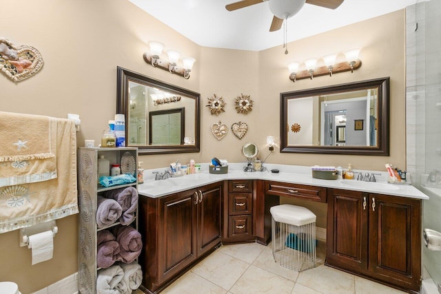 bathroom with double vanity, ceiling fan, and a sink