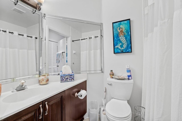 bathroom with visible vents, toilet, vanity, and a shower with curtain