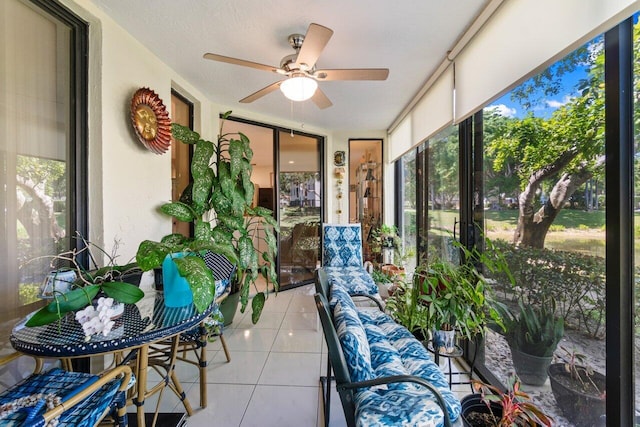 sunroom with a ceiling fan