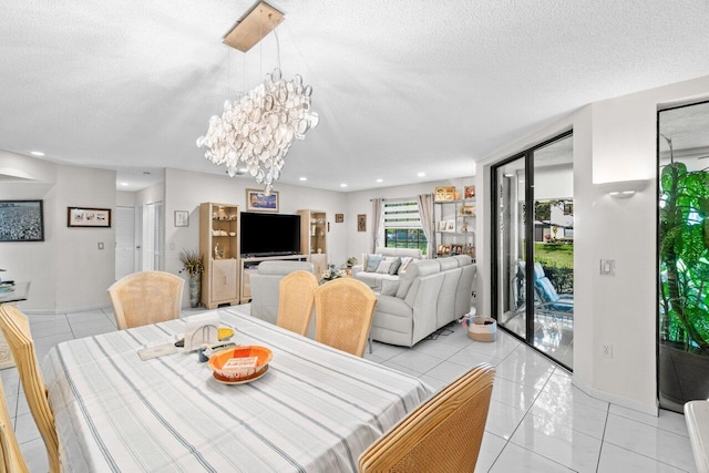 dining space featuring light tile patterned floors, a textured ceiling, a chandelier, and recessed lighting