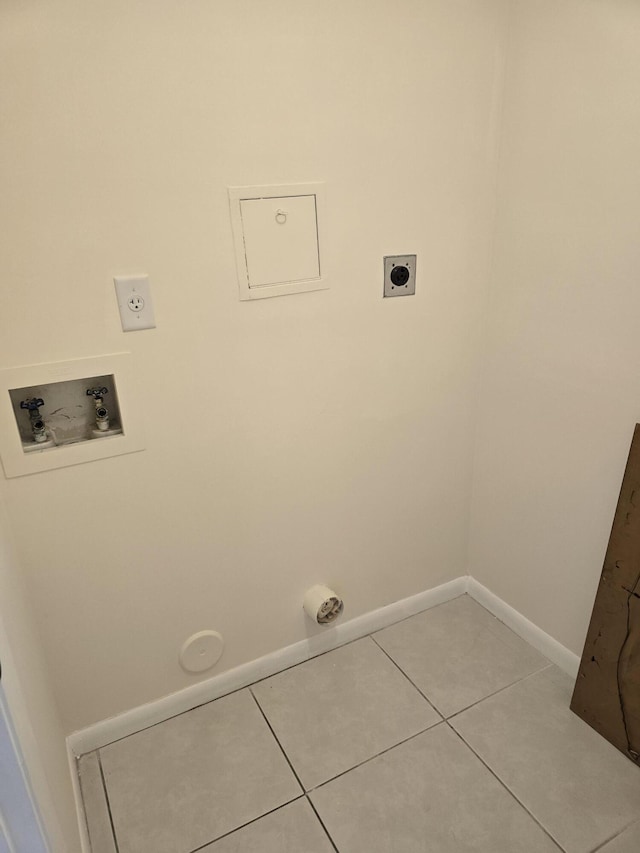 clothes washing area with electric dryer hookup, light tile patterned floors, baseboards, hookup for a washing machine, and laundry area